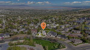 Drone / aerial view with a residential view and a mountain view