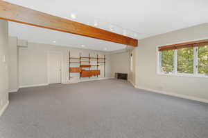 Unfurnished living room featuring recessed lighting, baseboards, and carpet floors