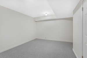 Finished below grade area featuring carpet and baseboards