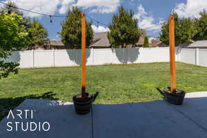 View of yard with a patio and a fenced backyard
