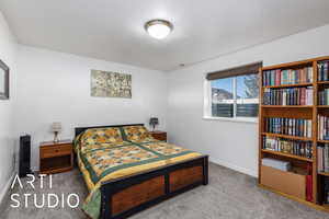 Bedroom with baseboards and carpet flooring