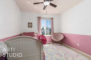 Bedroom featuring ceiling fan, carpet flooring, and baseboards