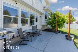 View of patio featuring fence