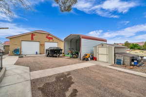 Detached garage with a carport and a storage unit