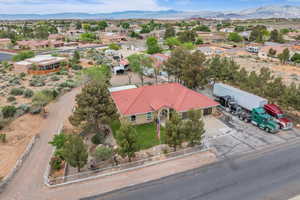 Birds eye view of property featuring a mountain view and a residential view