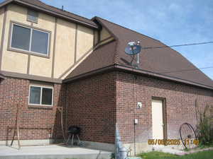 View of side of property with brick siding