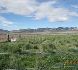 Property view of mountains featuring a rural view