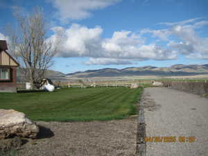 Property view of mountains featuring a rural view