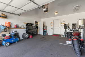 Garage featuring a garage door opener