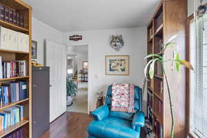 Living area with wood finished floors and stairs