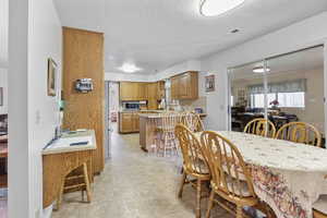 Dining space with a textured ceiling