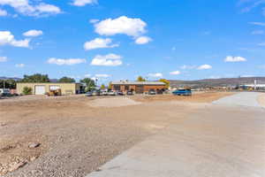 View of yard with a detached garage