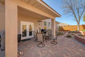 View of patio / terrace with area for grilling, fence, french doors, and outdoor dining space
