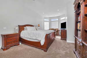 Bedroom with light carpet, baseboards, and recessed lighting