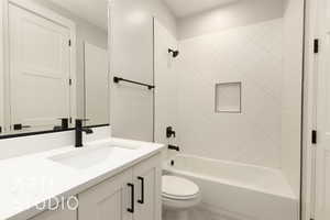 Full bathroom with toilet, shower / tub combination, and vanity