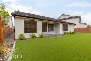 Back of property featuring stucco siding and a patio area