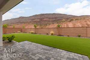 View of yard with a patio area and a mountain view