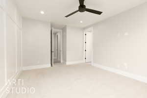 Unfurnished bedroom with recessed lighting, light colored carpet, baseboards, and ceiling fan