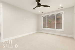 Spare room featuring carpet, recessed lighting, baseboards, and a ceiling fan