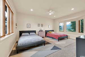 Bedroom with baseboards, multiple windows, and recessed lighting
