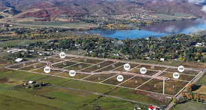 Aerial view of property's location featuring a large body of water