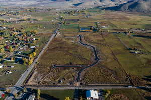 Birds eye view of property with a rural view and a mountain view
