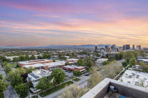Aerial view at dusk of a mountain view and a view of city