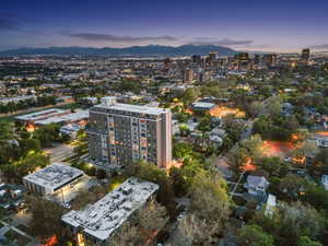 Aerial view at dusk of a mountain view and a view of city