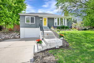 View of front of house with driveway and a garage