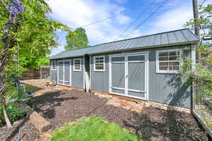 View of shed with fence