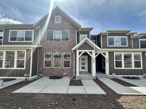 Multi unit property featuring board and batten siding and brick siding