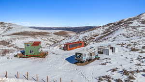 Snowy aerial view with a mountain view