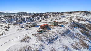Snowy aerial view featuring a mountain view