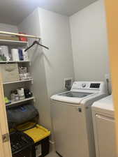 Laundry room with separate washer and dryer and laundry area