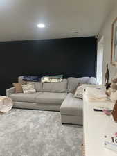 Living room with visible vents and carpet floors
