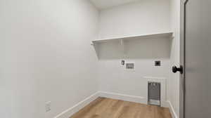Laundry area featuring light wood-style flooring, electric dryer hookup, laundry area, washer hookup, and baseboards