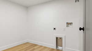 Laundry room featuring baseboards, washer hookup, light wood-style floors, laundry area, and electric dryer hookup