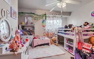 Bedroom featuring ceiling fan and carpet floors
