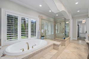 Full bath with a stall shower, crown molding, tile patterned floors, a bath, and recessed lighting
