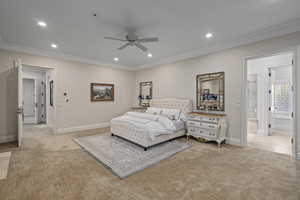 Bedroom featuring crown molding, light carpet, baseboards, and recessed lighting