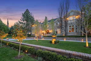 Exterior space with a yard and stone siding