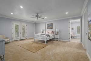 Bedroom with french doors, baseboards, light colored carpet, access to outside, and recessed lighting