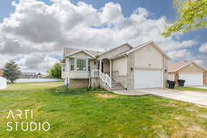 Single story home featuring concrete driveway, stucco siding, a front lawn, and a garage