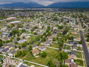 Birds eye view of property with a residential view and a mountain view