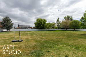 View of yard with fence