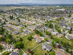 Birds eye view of property featuring a mountain view and a residential view