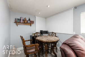 Tiled dining area featuring baseboards