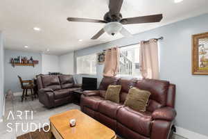 Living area featuring baseboards, recessed lighting, and ceiling fan