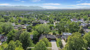 Aerial perspective of suburban area featuring a mountainous background