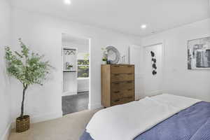 Bedroom featuring carpet floors, baseboards, and recessed lighting